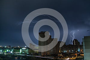 Lightning over the city at night