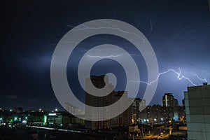 Lightning over the city at night