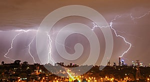 Lightning over city skyline