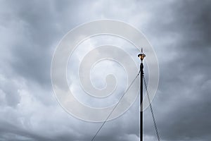 Lightning rod and cloudy sky