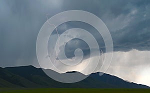 Lightning shoots out from thunder storm clouds over Idaho plains