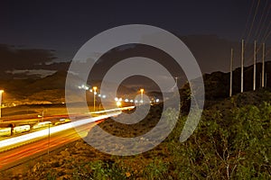 Lightning storm over asphalt road