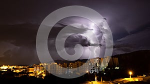 Lightning during a storm over the city of iglesias, south sardinia photo