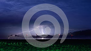 Lightning storm over windmill eolian park in Romania