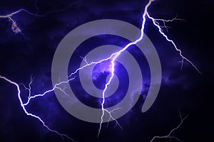 A lightning strike on a cloudy dramatic stormy sky.