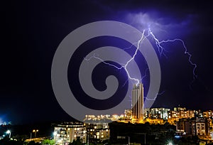 Lightning strikes a building.