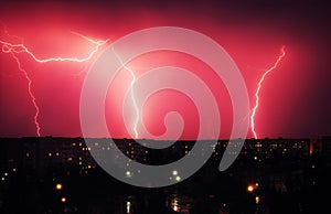 Lightning strikes down over the city at night. Beautiful shot. L