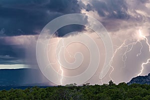 Lightning strikes and heavy rain during a thunderstorm