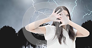 Lightning strikes and scared afraid woman