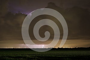 Lightning striking down from a distant thunderstorm