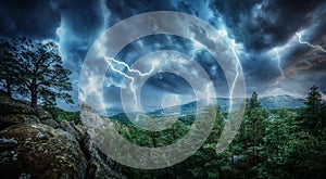 Lightning thunderstorm flash in the mountains. Concept on topic photo