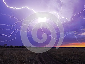 Lightnings at the field at the sunset