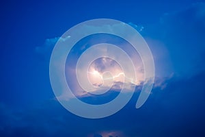Lightnings in storm clouds. Peals of a thunder and the sparkling lightnings in clouds