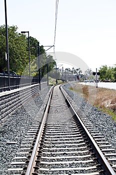 Lightrail tracks and road with traffic