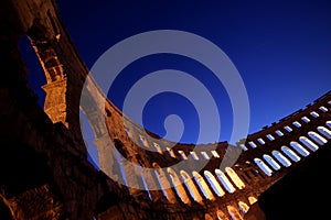 Lights through the arches of the amphitheatre in P