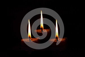 Lights of candles in a dark symbol of hope