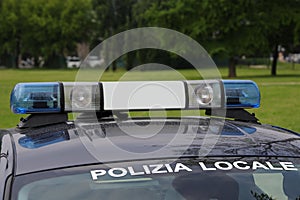 Lights on the CAR with text POLIZIA LOCALE that means Local Poli