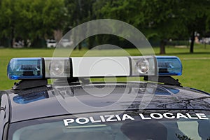 Lights on the CAR with text POLIZIA LOCALE that means Local Poli photo