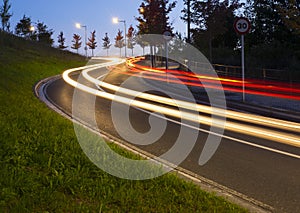 Lights of the cars on the road to the tunnel.