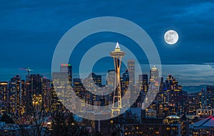 The lights come on in Seattle with a full moon