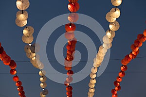 Lights and decoration in amusement park over evening sky