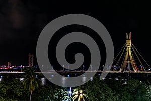 Lights of Encanta Moca, Enchanted lady Bridge and Capibaribe river night view from Shopping Rio Mar, Recife, Pernambuco, Brazil photo