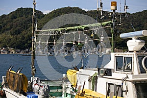 Lights from a fishing boat prepared to attract octopuses in Ine fishing village in Japan.