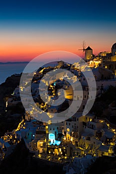 Lights of Oia village at night, Santorini, Greece.