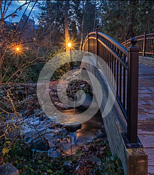 Lights reflected on stream through Lithia Park in Ashland, Oregon