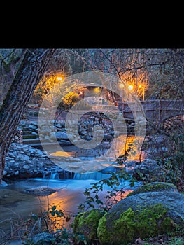 Lights reflected on stream through Lithia Park in Ashland, Oregon photo