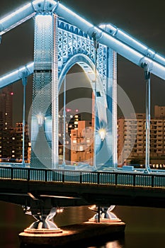 Lights on Self-Anchored Suspension Bridge over River photo