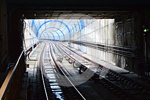 Lights and Shadows in a Curved Metro Tunnel