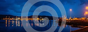 Lights, ships and boats in a Castletownbere harbor at night