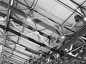 Lights and ventilation system in long line on ceiling of the industrial building. Exhibition Hall. Ceiling factory construction