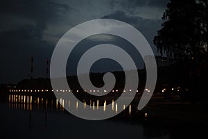 Lights on waterfront. Lake at night in park