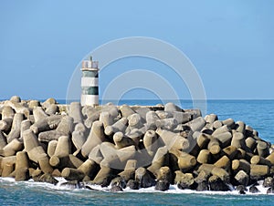 Lighttower and harbor entrance in Nazare, Centro - Portugal