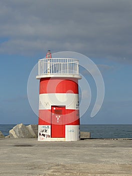 Lighttower and harbor entrance in Nazare, Centro - Portugal