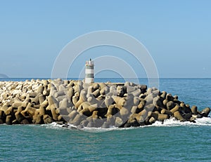 Lighttower and harbor entrance in Nazare, Centro - Portugal