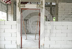 lightweight cement brick and white lintel plaster to joint for reinforce door in house construction site