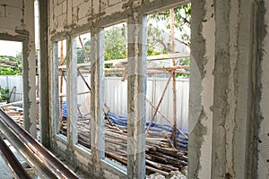 lightweight cement brick and white lintel plaster to joint for reinforce widow house frame in construction site. crack cement