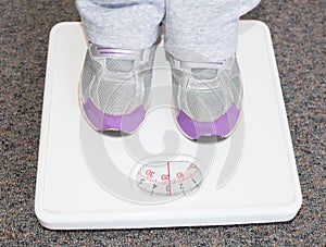 Lightweight Child on Bathroom Scales.