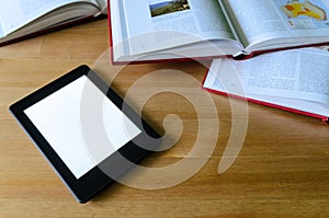 Lightweight e-book (electronic reader) compared to heavy thick b