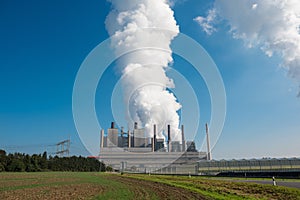 Lignite power plant for electricity generation - steam rises fro