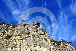 Liguria: view from the cliff island of Palmaria island with rocky sky trees and clouds