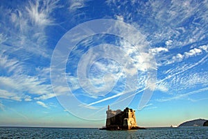 Liguria: View of Ligurian coastline with mountains sea sky boat and clouds