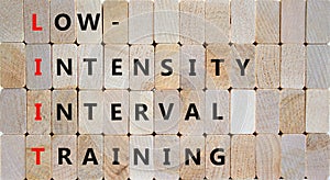 LIIT low-intensity interval training symbol. Concept words LIIT low-intensity interval training on blocks on a beautiful wooden