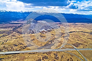 Lika region. Zir hill and Velebit mountain in Lika landscape view. A1 highway