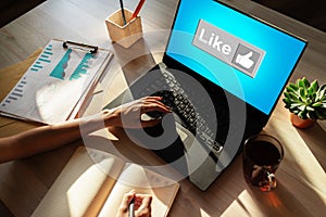 Like button on screen. SMM, Social media marketing concept. photo