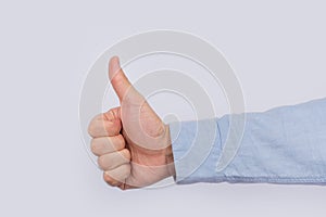 Like hand symbol, gesture well done. Thumbs up on light background