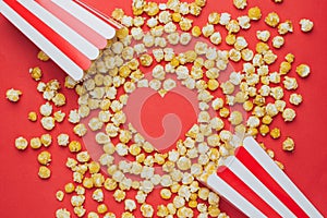 Like heart and popcorn on a red background top view